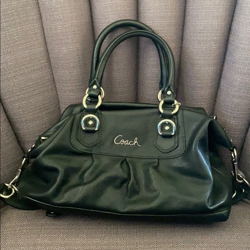 Black coach purse with purple lining